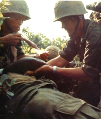 Corpsman applying Field Dressing