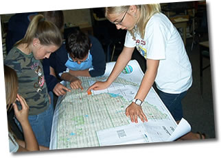 Students study the Municipal District map.